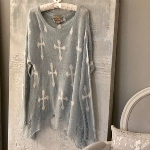 Baby blue distressed Wildfox sweater with crosses